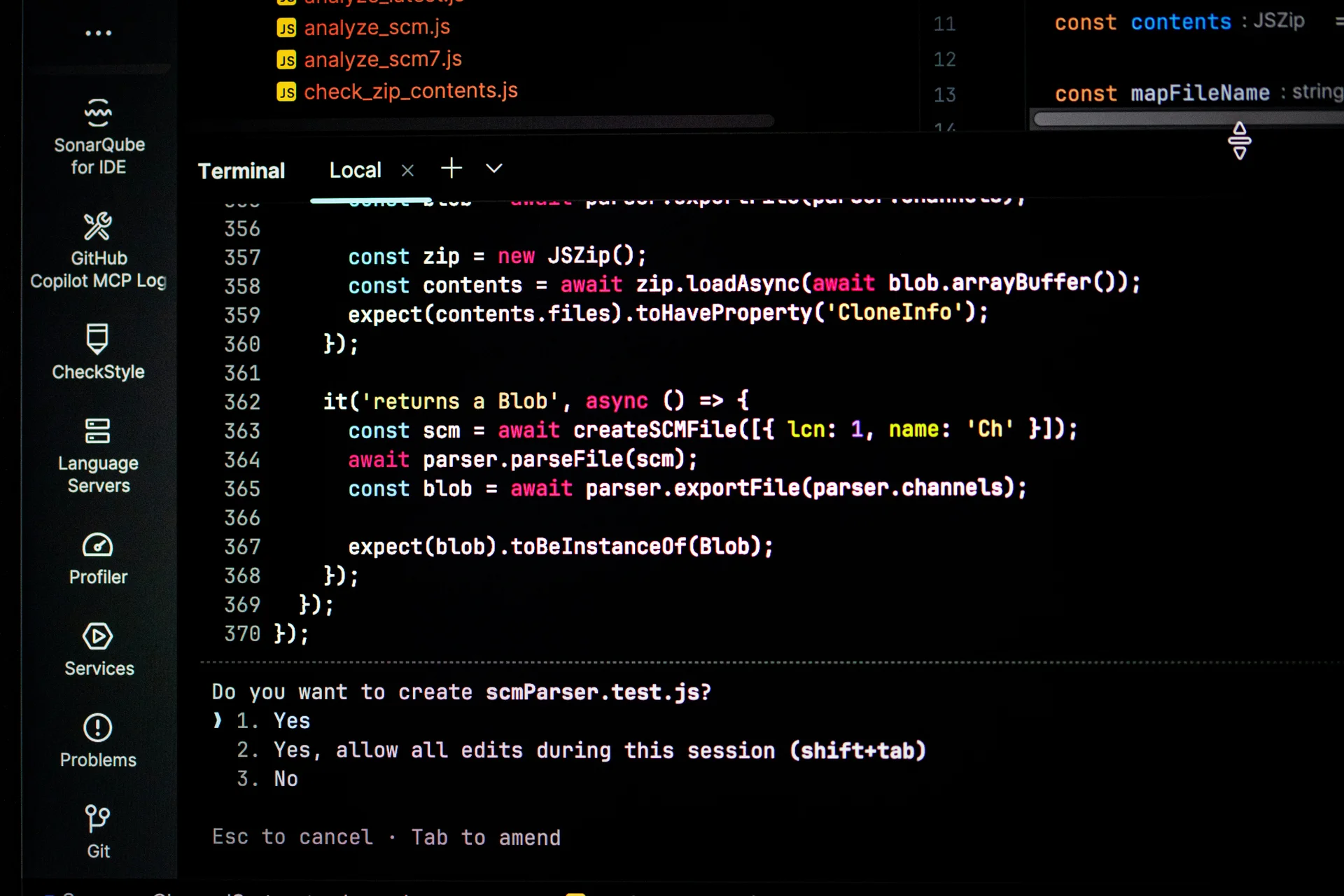 Development environment with JavaScript code and a terminal asking to create a test file.